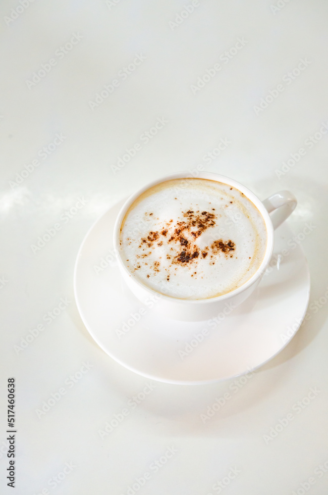 cappuccino coffee on white table soft focus cappuccino coffee on white table soft focus