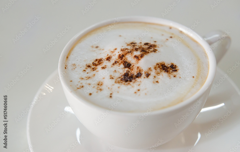 cappuccino coffee on white table soft focus cappuccino coffee on white table soft focus