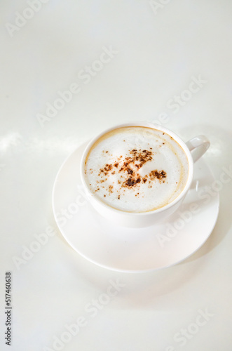 cappuccino coffee on white table soft focus