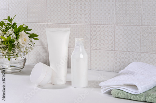 Natural cosmetics, skin care product on table in bathroom. Blank cosmetic skincare makeup containers.