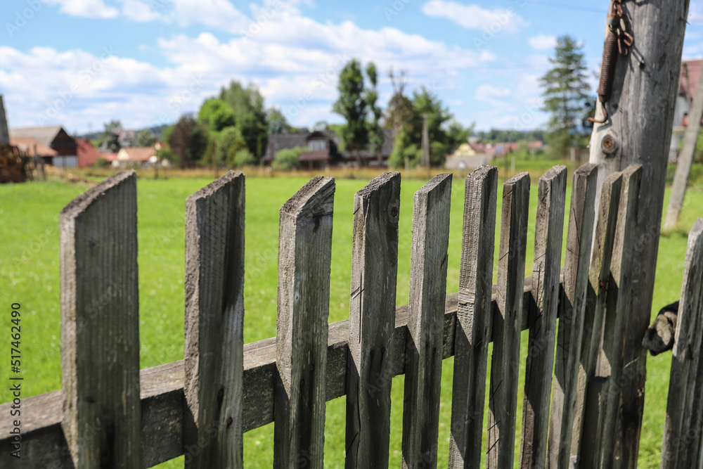 Wooden fence on a highlander's pasture in Carpathian Mountains.