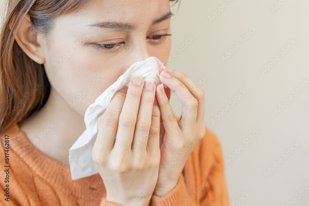 Sick, Coronavirus covid asian young woman, girl have a fever, flu, hand in use tissues paper sneezing nose, runny and cough, standing on isolated background. Health care to disease influenza seasonal Sick, Coronavirus covid asian young woman, girl have a fever, flu, hand in use tissues paper sneezing nose, runny and cough, standing on isolated background. Health care to disease influenza seasonal