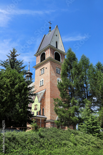 SKOMIELNA BIALA, POLAND - JULY 14, 2022: Brick-built belfry for a church in Skomielna Biała, Poland. photo