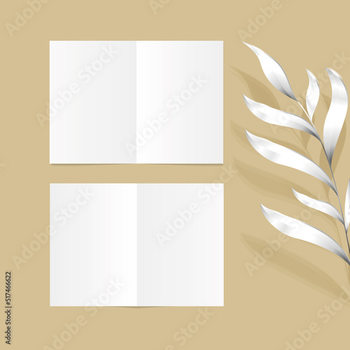isolated realistic half-fold standart leaflet with silver leaves on the sand color background editable mockup for layout presentation, empty page, set
