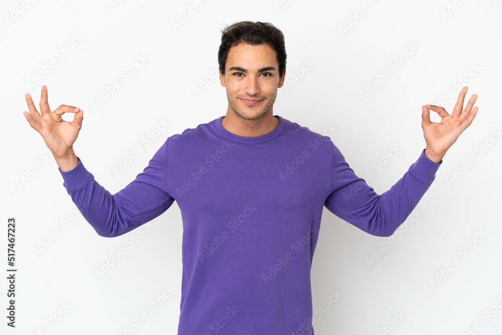 Caucasian handsome man over isolated white background in zen pose Caucasian handsome man over isolated white background in zen pose