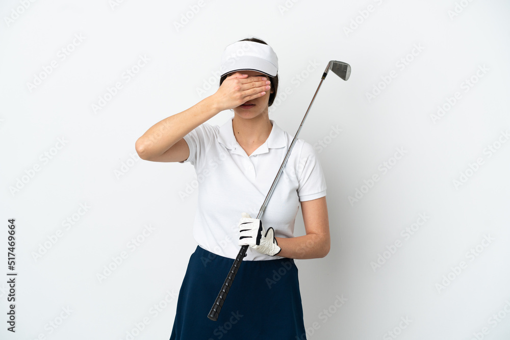 Handsome young golfer player woman isolated on white background covering eyes by hands. Do not want to see something Handsome young golfer player woman isolated on white background covering eyes by hands. Do not want to see something
