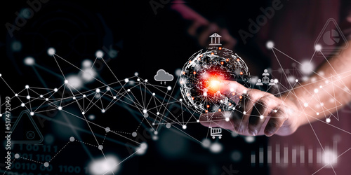 Businessman touching virtual screen a global network connection on investor and customer with sale data exchange and Internet of Things,Financial and banking. Technology and digital marketing