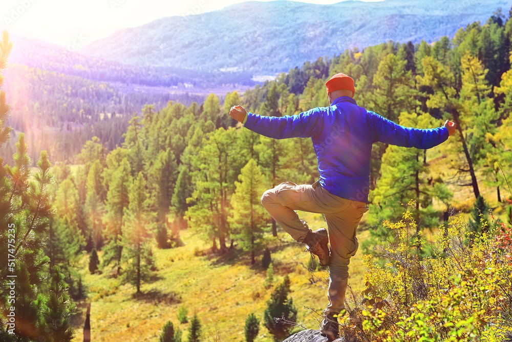 Naklejka premium buddhism meditation travel, man doing yoga in traditional yellow pants in nature