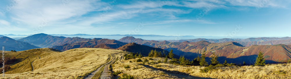 Rural road in autumn mountain.