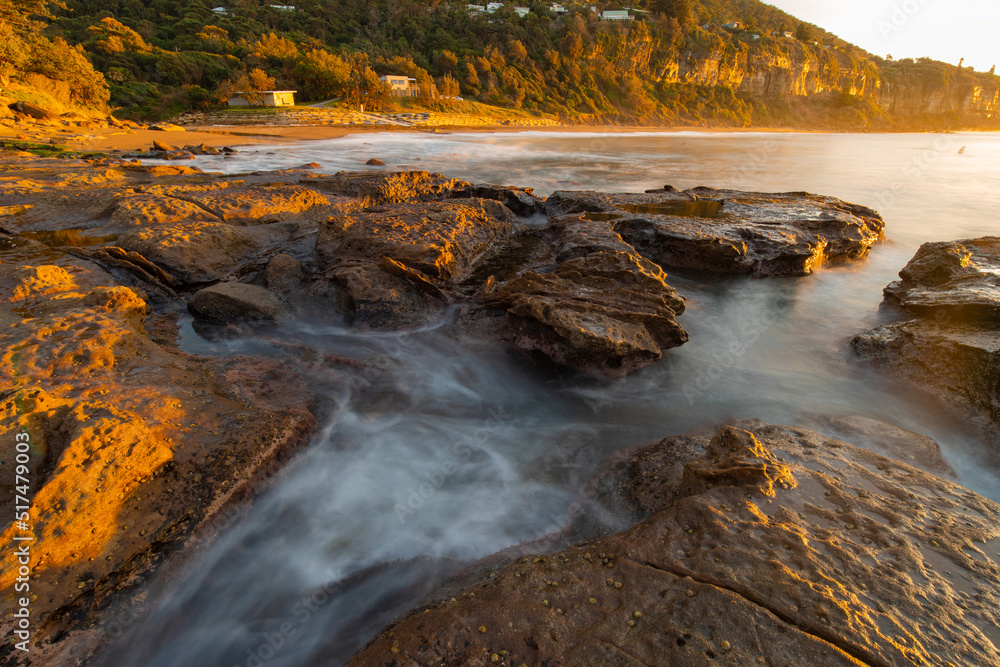 Water flowing between rocks on the coastline. Water flowing between rocks on the coastline.
