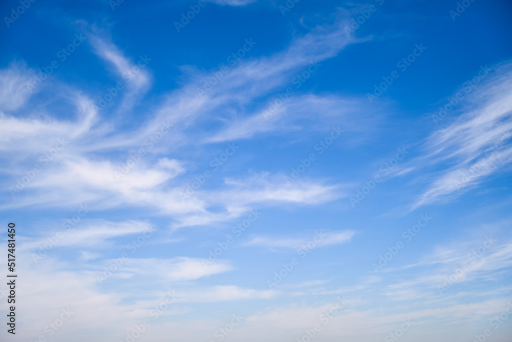 Blue sky with thin cirrus clouds, daytime landscape