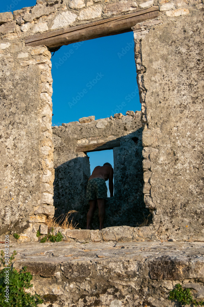 Ksamil, Albania A male  tourist visits the Ali Pasha Ottoman castle at the inlet of Lake Butrint.