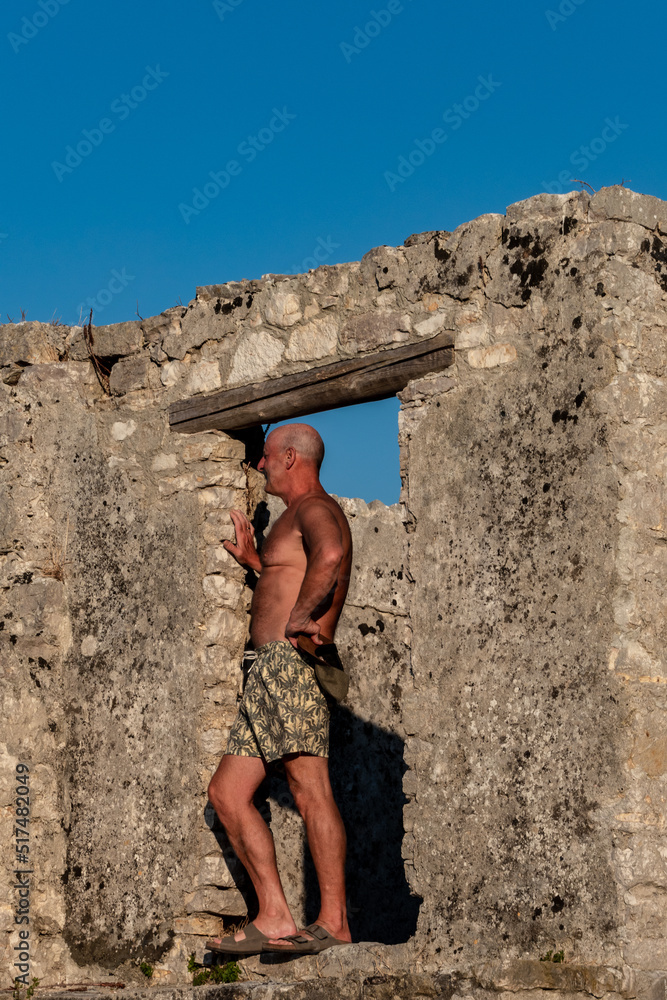 Ksamil, Albania A male tourist visits the Ali Pasha Ottoman castle at the inlet of Lake Butrint.