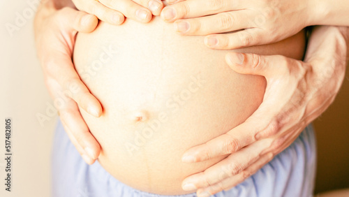 Wallpaper Mural Pregnant woman belly hands. Happy pregnancy woman and husband hugging pregnant belly. Concept maternity, pregnancy, childbirth. Torontodigital.ca