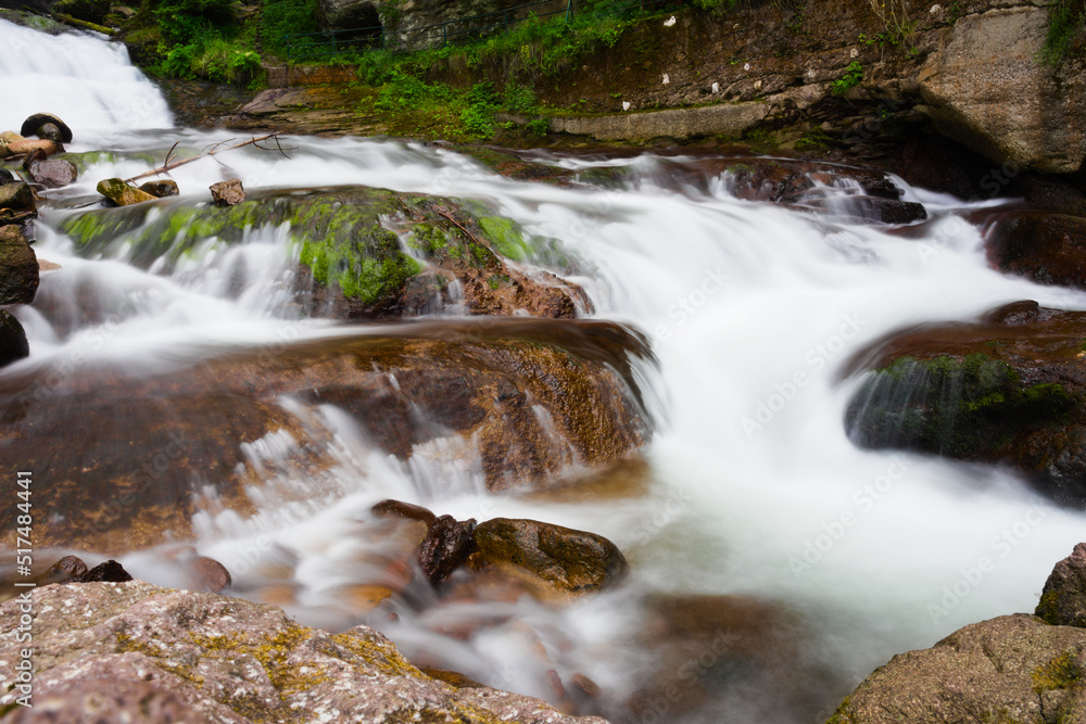 Fassa Valley, Italy, waterfall in the forest Fassa Valley, Italy, waterfall in the forest