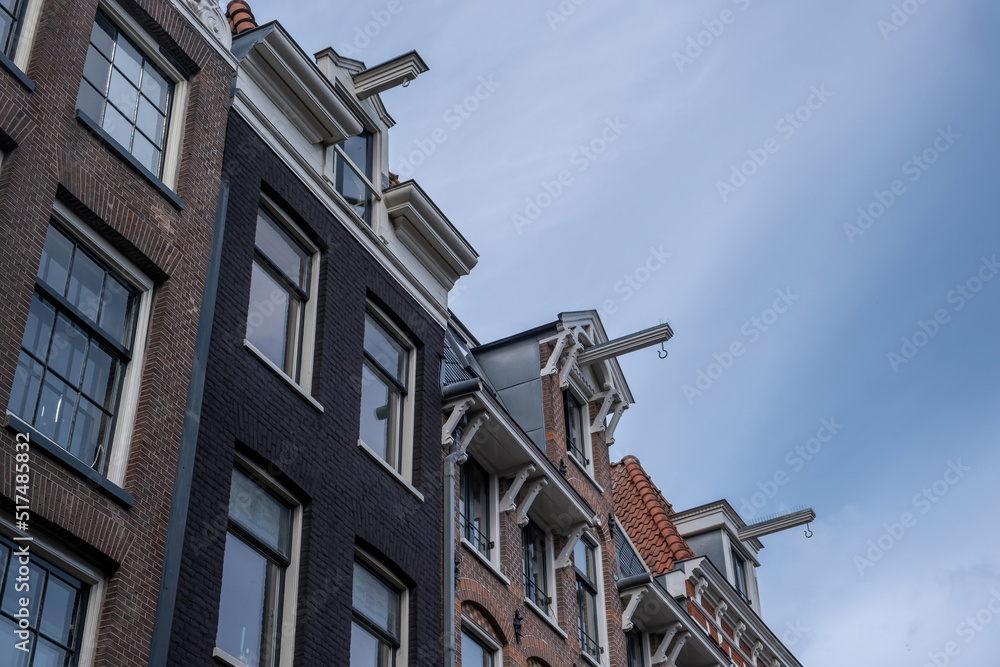 Amsterdam, Holland Netherlands, building attic where were stored goods with hook on rope. Under view Amsterdam, Holland Netherlands, building attic where were stored goods with hook on rope. Under view