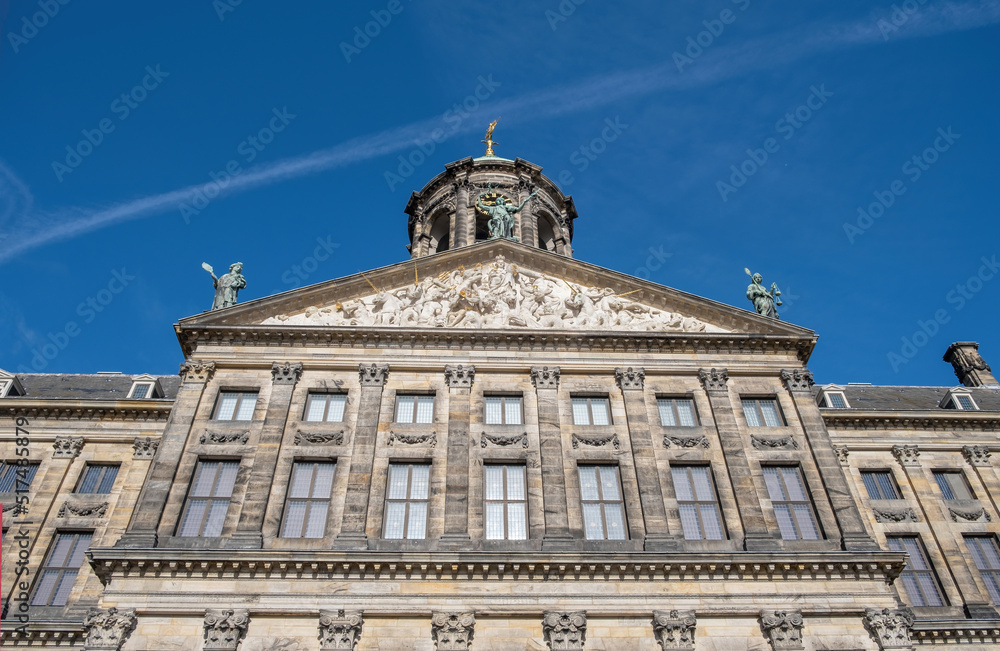 Royal Palace Amsterdam at Dam Square, Holland Netherlands. Ornate building, sculpture. Under view