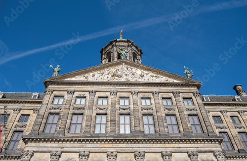 Royal Palace Amsterdam at Dam Square, Holland Netherlands. Ornate building, sculpture. Under view