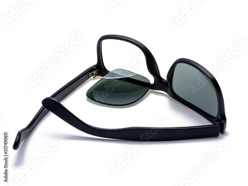 Black broken sunglasses, the lens fell out of the frame, isolated on white