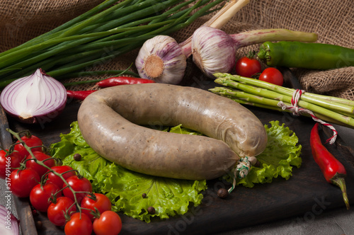 traditional liver sausage with liver decorated with fresh vegetables