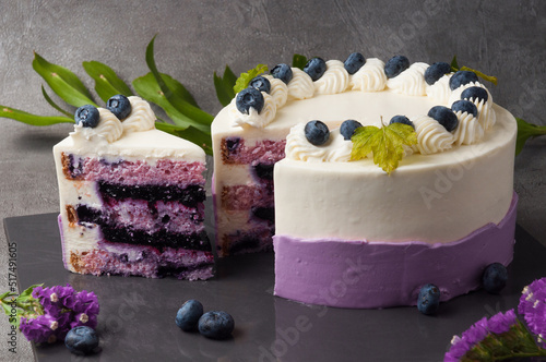 Lavender sponge cake in combination with blueberries, soaked in cheese cream with cream in a duet with fresh blueberries