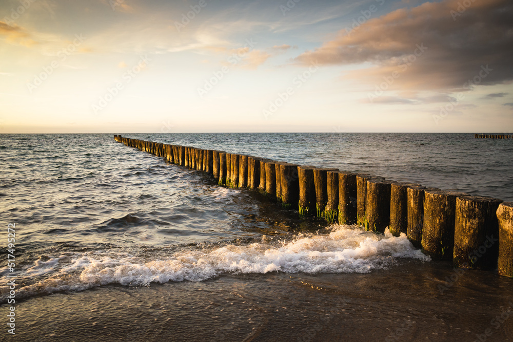  wooden breakwater in sea