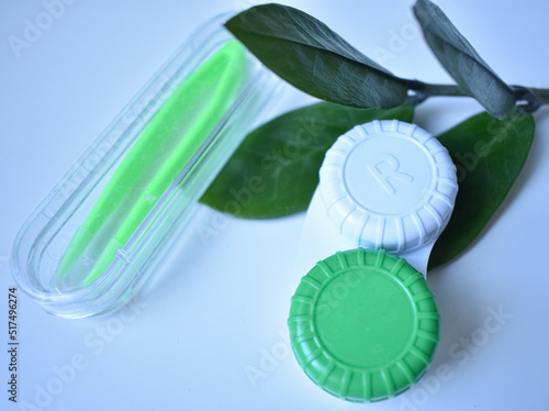 contact lenses in a green container