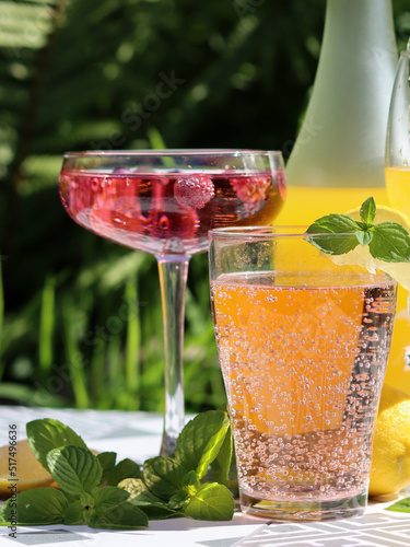 Refreshing beverages close up photo. Summer cocktails on a table. Party in a garden. 