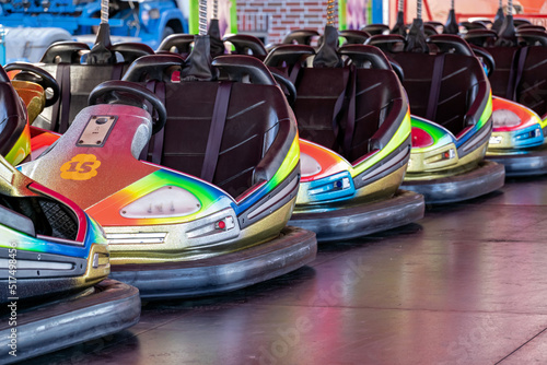 row of electric bumper cars on funfair photo