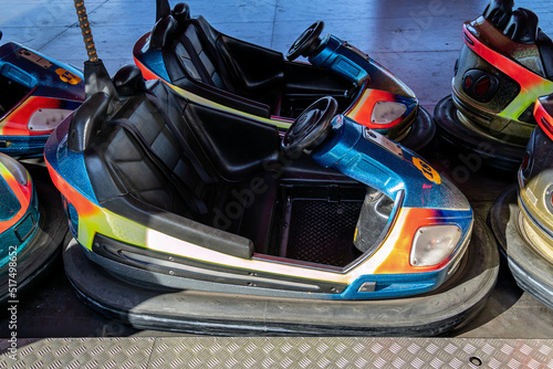 row of electric bumper cars on funfair