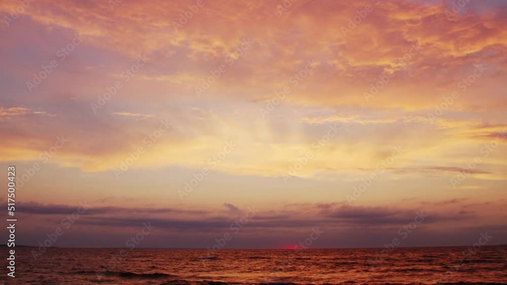Timelapse with Sunset and Cumulus Clouds Flying High in a Beautiful Blue Sky. Sun Dawn over the Sea. Weather, Climate Change and Global Warming . Timelapse with Sunset and Cumulus Clouds Flying High in a Beautiful Blue Sky. Sun Dawn over the Sea. Weather, Climate Change and Global Warming .