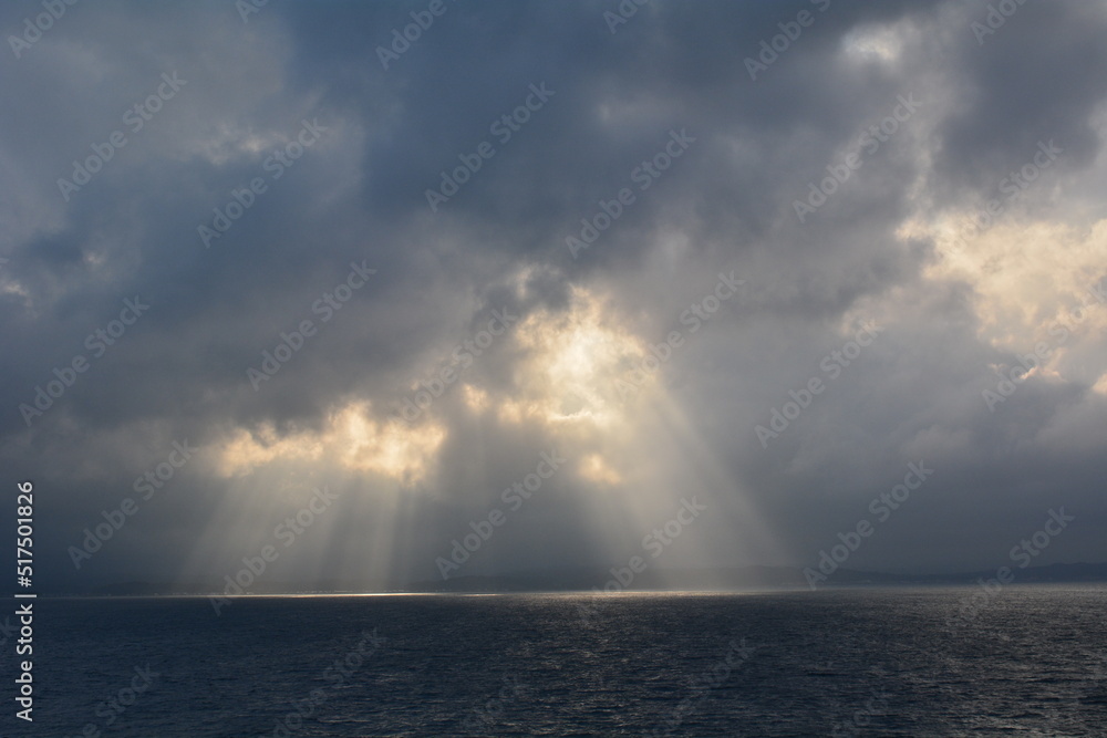 clouds and lights over sea