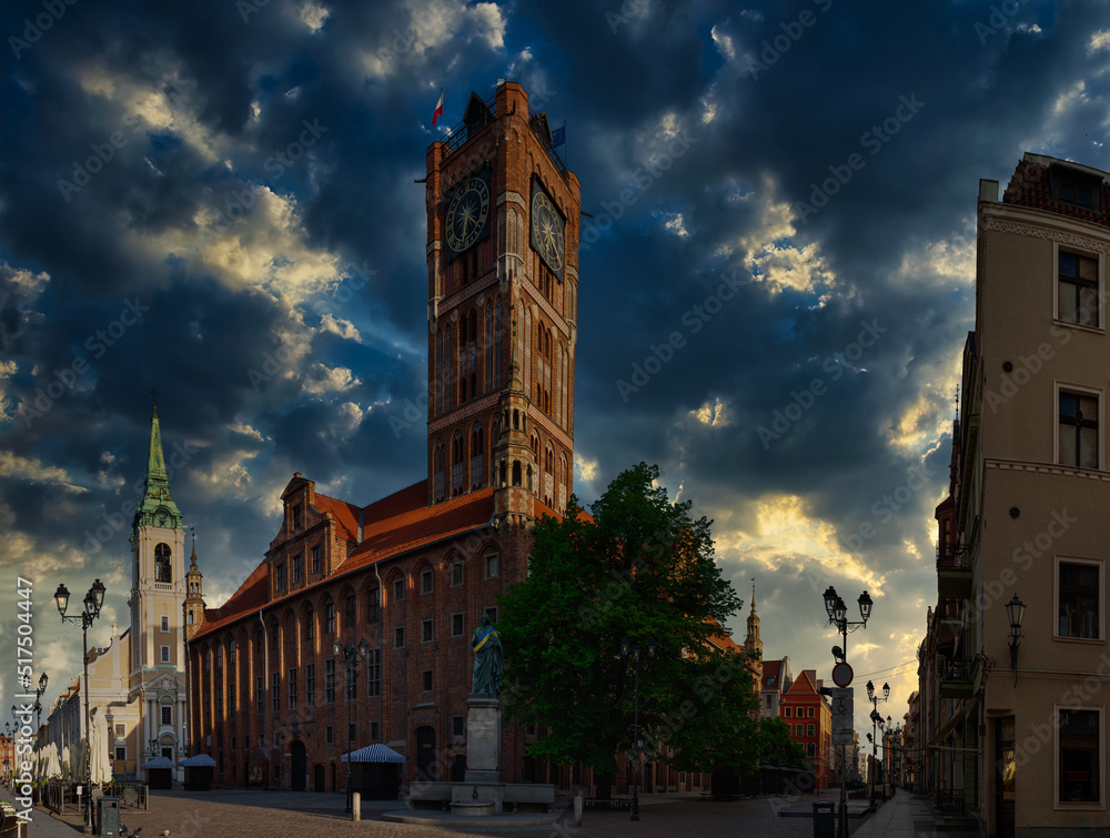 Toruń - View of the Old Town Hall and the statue of Nicholas Copernicus. May 2022, Poland.