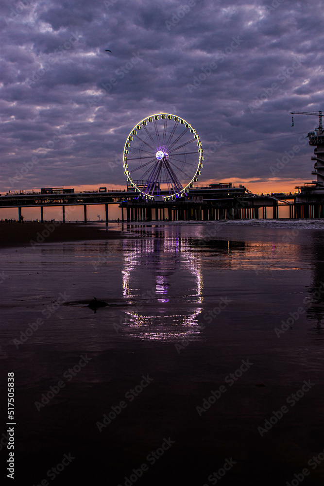 Ferris wheel reflection on the wave