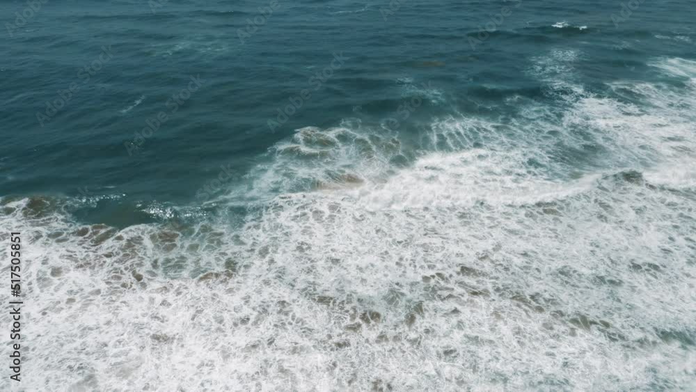 High angle view of incoming waves at the Atlantic coast in Morocco. Nature water background in ocean blue. 4k footage.
