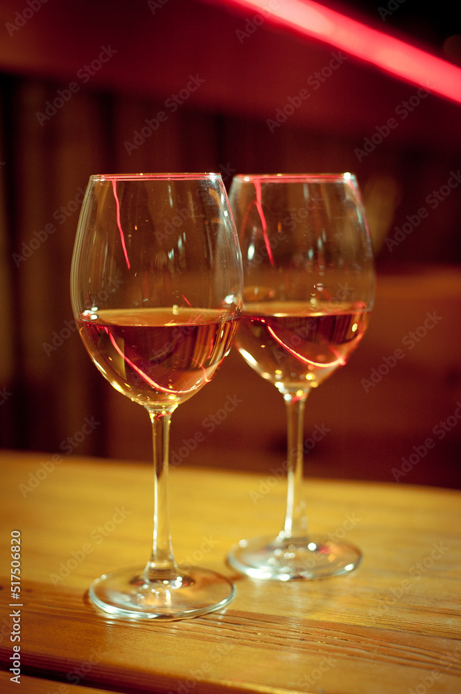 Dvuhbokala white wine on a wooden table. Dvuhbokala white wine on a wooden table.