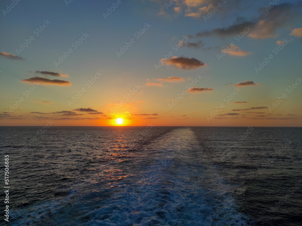Obraz premium sunset over the sea from a boat