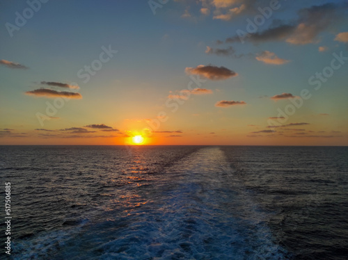 sunset over the sea from a boat