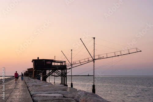 Traditional fishing house at sunrise, Dam of Sottomarina, Chioggia, Italy.