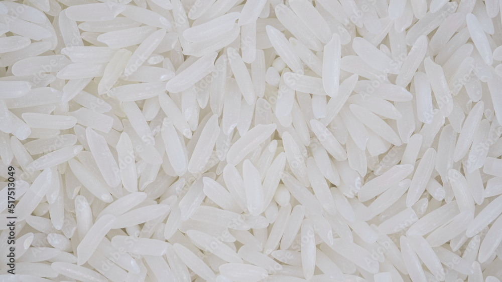 organic white raw jasmine- basmati rice background, white long seeds. macro closeup. as picture backdrop or background pattern texture organic white raw jasmine- basmati rice background, white long seeds. macro closeup. as picture backdrop or background pattern texture