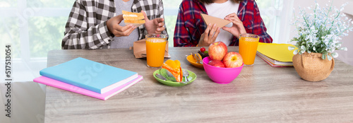 Teenage girls enjoy eating breakfast before go to school, Back to school concept