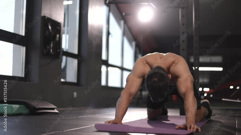 Strong Athletic Fit Middle Age Man Training on a Yoga Mat, Doing Back Stretching and Core Strengthening Exercises During Morning Workout at Home in Gym. Concept of Health and Fitness.
Strong Athletic Fit Middle Age Man Training on a Yoga Mat, Doing Back Stretching and Core Strengthening Exercises During Morning Workout at Home in Gym. Concept of Health and Fitness.