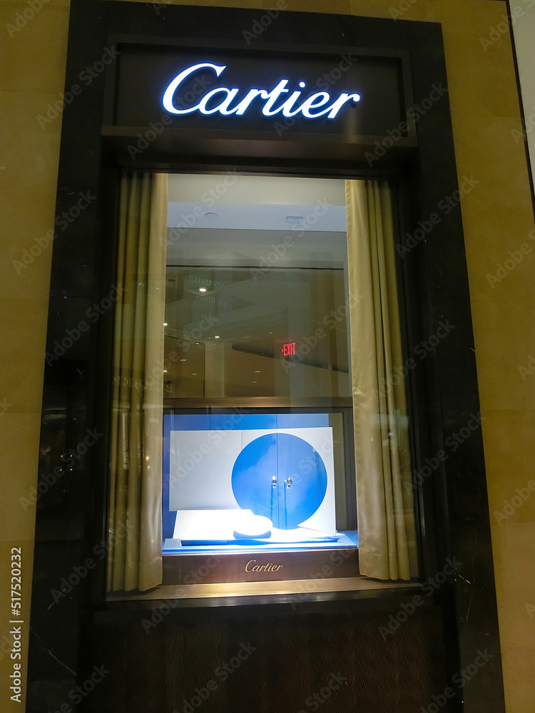 Sign with Cartier logo at shopwindow of Cartier store in Aventura Mall