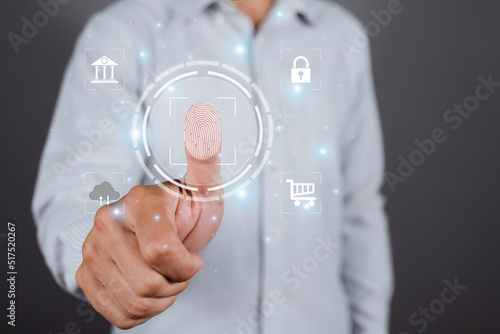 Man touching fingerprint scan provides security login to interface payment shopping banking and cloud computer network connection allows access to security of big Data businesses on virtual screen.