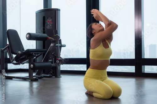 Fototapeta Naklejka Na Ścianę i Meble -  Yoga teacher Flexible slim doing splits workout, practice yoga or pilates. Woman natural beauty and wellness at fitness
