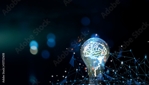 Glowing lightbulb with virtual brain and orange light . Creative new business idea concept.