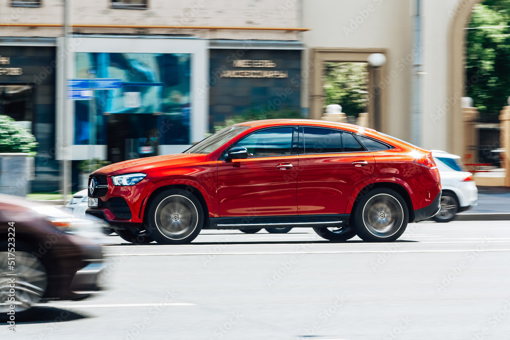 Gle Fast One Mercedes GLE 400D car is driving fast against urban background ...