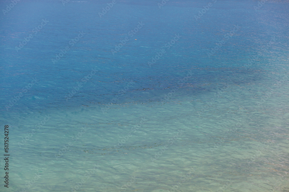 Obraz premium Seascape of clear water on the sea. Clear water on the ocean, sea or lake. Water ripples in the sun.