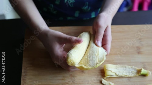 kid peeling bananas at home Meal preap photo