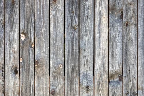 Grey barn wooden wall planking texture. hardwood dark weathered timber surface. old solid wood slats rustic shabby gray background. grunge faded wood board panel structure, close up